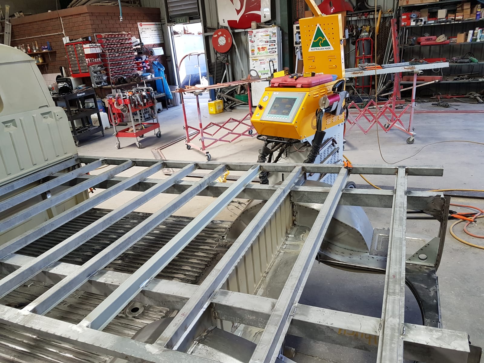 Race car tube-frame chassis fabrication at MRP Automotive workshop