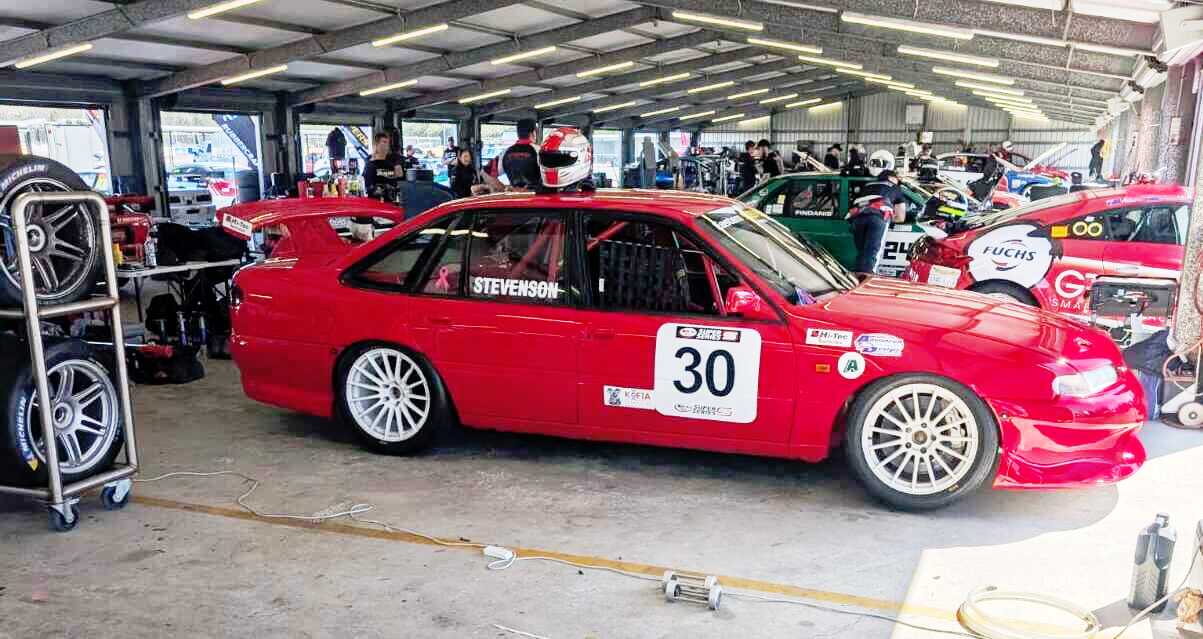 Race car preparation in the pit garage — MRP Automotive